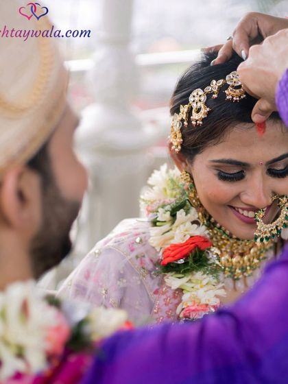Elevate your journey to love with India's premier matrimonial app. This beautiful image captures a moment of blessing and union.