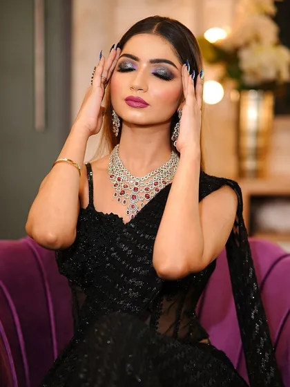 An eyes-closed shot to give a better view of the blended smokey eyeshadow with a pop of purple.