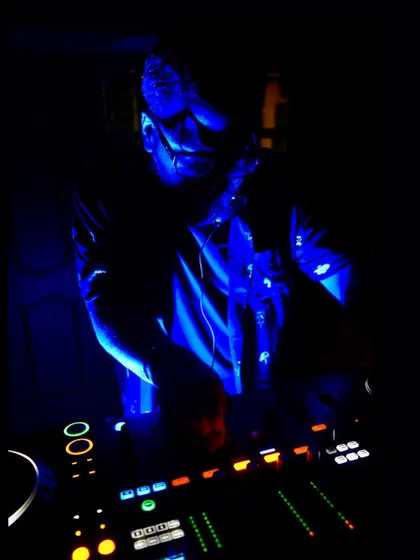 A moody shot of me at the decks, deep in concentration during a set in Goa. The blue light and intense focus capture the atmosphere of a late-night session.