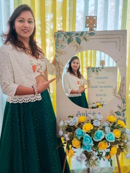 Having a little photoshoot before the guests arrive for a Haldi function. The welcome sign makes for a great prop.