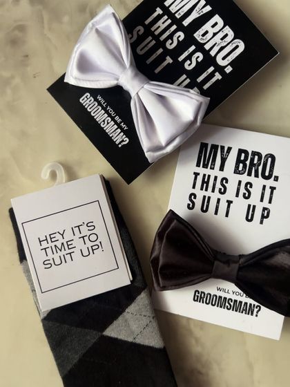 Another variation of the groomsmen proposal, this time including fun socks with the "Suit Up" card and bow tie.
