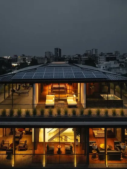 As night falls, 'The Light House' transforms into a warm beacon against the city skyline. The design ensures that the home feels just as inviting and alive after sunset, with carefully planned lighting that highlights its architectural form and the life within.