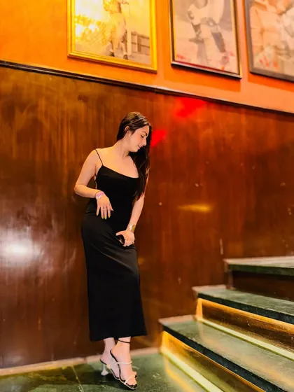 Another angle of the black slip dress, showcasing its simplicity and elegance.