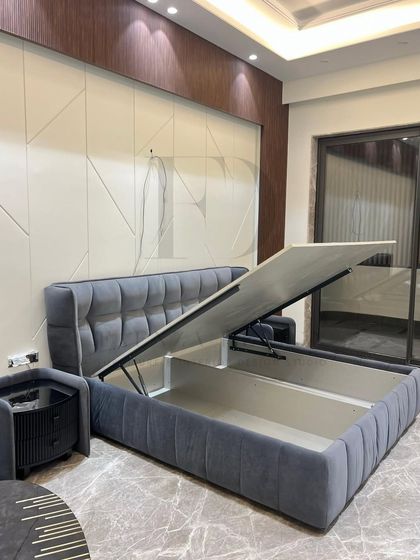 This bed is as functional as it is beautiful. The hydraulic lift reveals a large, concealed storage space, perfect for keeping your bedroom clutter-free. The tufted grey velvet adds a touch of luxury.