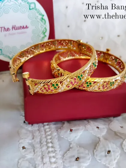 The restocked 'Trisha' bangles. These sleek bangles feature a beautiful multi-coloured stone design.
