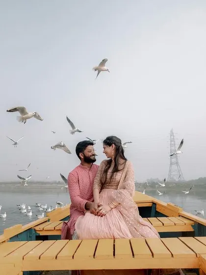 Amidst the morning mist and a flight of seagulls at Delhi's Yamuna Ghat, we found a moment of serene beauty. This is what we live for: capturing the quiet, poetic instances of your love story in the most unexpected and beautiful locations.
