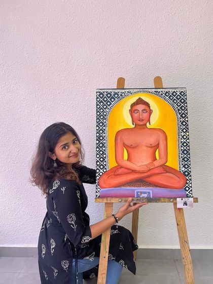 Another pose with the Mahavir Swami canvas. The vibrant colors and serene expression were central to capturing the essence of this spiritual figure.