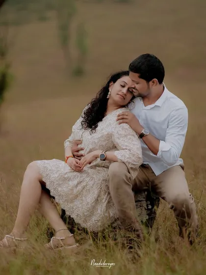 A peaceful and intimate portrait of a couple resting together in a field, capturing a moment of quiet love.