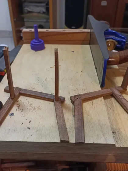 Building a miniature model of a chair is a great way to work out the joinery and angles before tackling the full-size version. Here, the leg assemblies are being prepared.