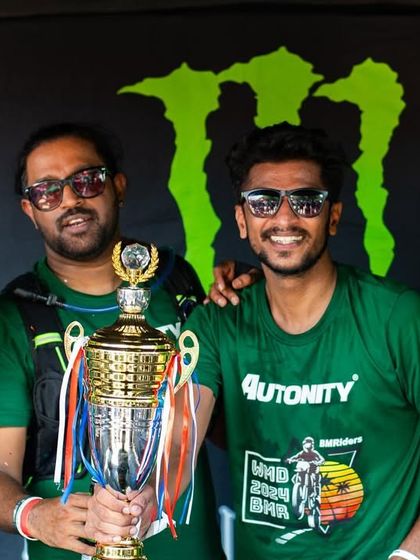 Posing with the trophy at the World Motorcycle Day event. Moments like these, celebrating with our brothers against the backdrop of a major sponsor like Monster Energy, make all the miles worth it.