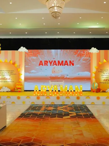 We love creating grand and immersive experiences. For this sunshine-themed naming ceremony, we designed a full stage setup with a vibrant LED screen backdrop, custom sun-shaped props, and cheerful balloon garlands to welcome baby Aryaman.