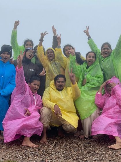 Our group in colorful raincoats, fully prepared to enjoy the monsoon trek in Chikmagalur.