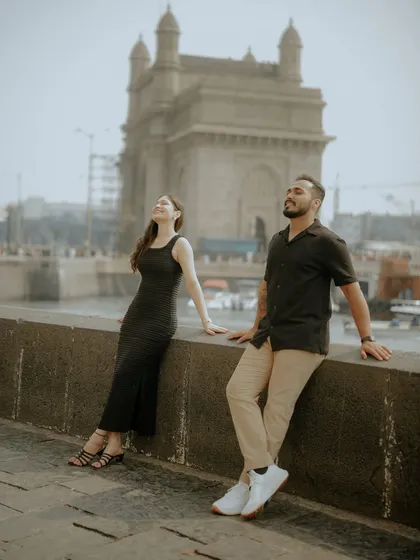 Soaking in the soul of Mumbai. A quiet moment for the couple against the majestic Gateway of India, proving that even in the heart of the city's hustle, you can find your own world together.