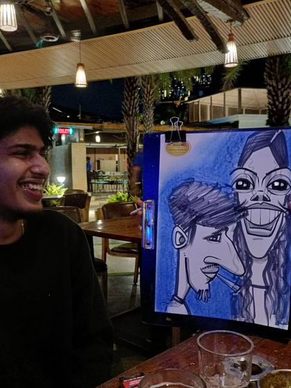The laughter says it all. This guest is having a great time reacting to the caricature.