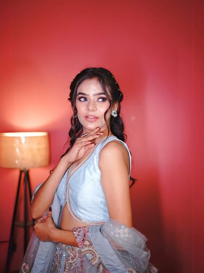 Another close-up focusing on the makeup and hairstyle. A soft glam look with defined eyes goes perfectly with the elegance of this ethnic outfit.