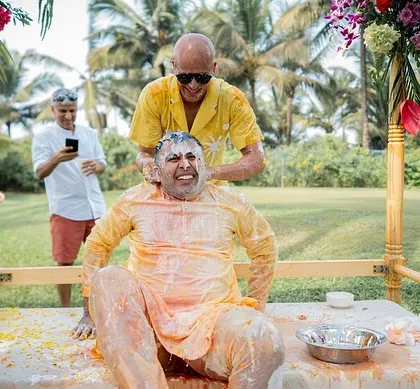 The groom getting a 'dahi' treatment from his friends during the Haldi ceremony.