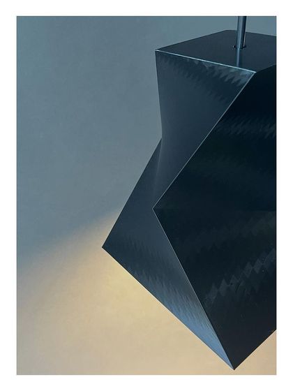 'Shifting Squares', a series of pendant lamps we designed and 3D-fabricated in our own MakerSpace. This exploration in digital fabrication and geometry demonstrates our hands-on approach to creating custom design elements for our projects.