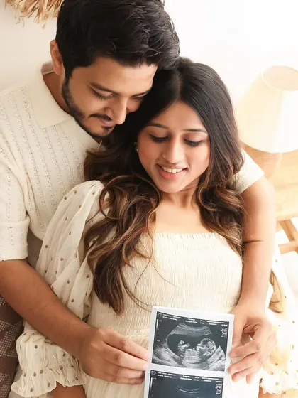 Sharing a first look at their baby. This photo captures the wonder and excitement of seeing their little one on the sonogram for the first time together.