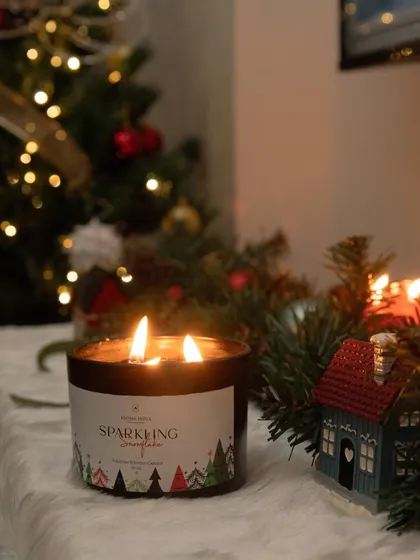 The 'Sparkling Snowflake' candle, part of our Christmas collection, adds a festive touch to this holiday scene. Its fragrance is crafted to evoke the feeling of a crisp, celebratory winter day.