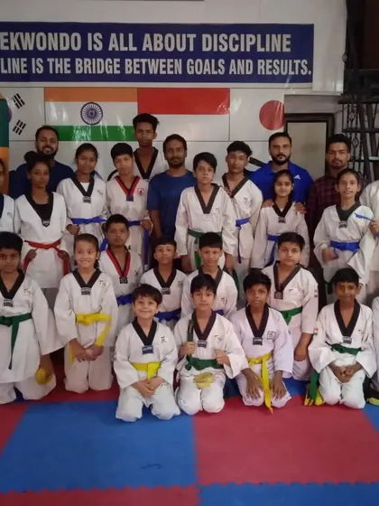 A proud group photo with the examiners after a successful belt promotion test. It's a day of celebration for the entire academy.