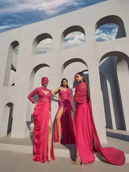 A trio of looks in hot pink, showcasing the versatility of this vivid hue, from a one-shoulder gown to a draped two-piece set.