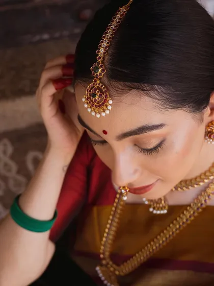 Another portrait from the temple jewelry shoot, focusing on the intricate details of the headpiece and necklace.