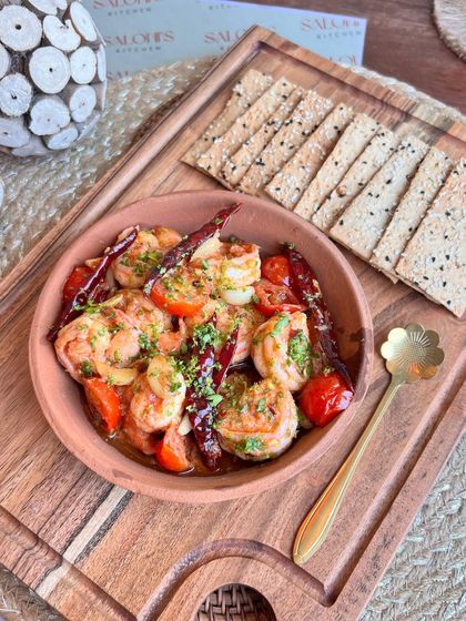 Exquisite Prawn Gambas served with herb lavash. This dish brings a touch of Spanish elegance to your appetizer selection.