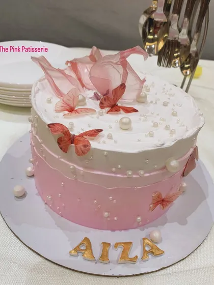 A pink ombre cake for Aiza, decorated with edible butterflies and pearls.