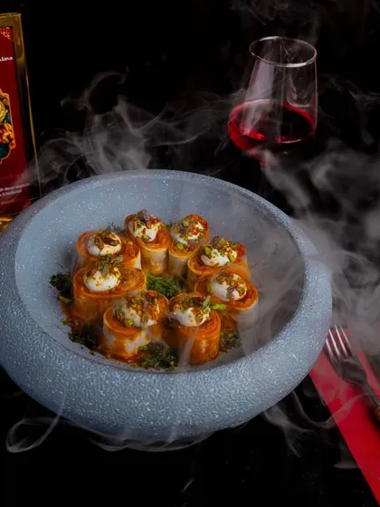 Experience culinary artistry with our Chicken Beyti Kebab. Rolled in lavash and served with yogurt, every bite is a symphony of flavors that will transport you to a realm of gastronomic bliss.