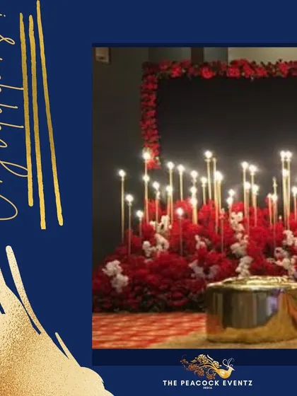 This red and gold theme is perfect for a vibrant Sangeet or cocktail party. The decor features a dramatic stage with a bed of red flowers and tall candle stands, creating a look that is both modern and luxurious.