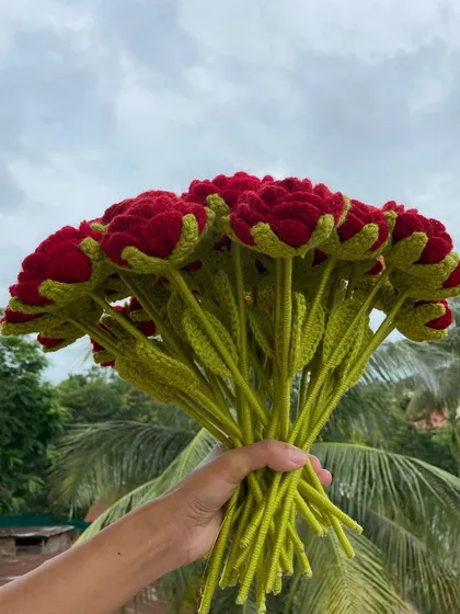 A side view of the red rose bouquet, showing the stems.