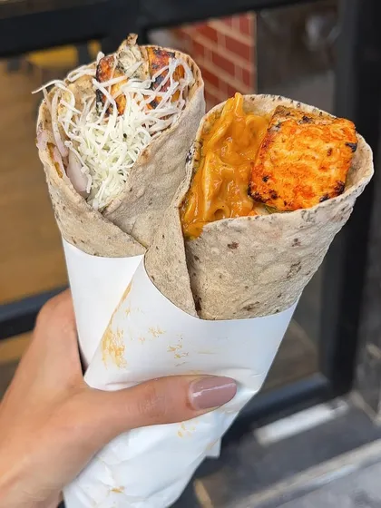 Holding up my two popular rolls, the Kolhapuri Paneer Roll and the Kurkure Paneer Roll. Which one would you choose?