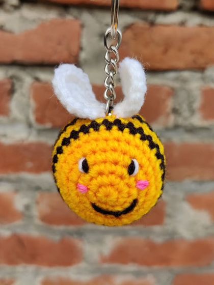 My super popular bumblebee keychains. They come in the classic yellow and black, but I also make them in fun colors like pink, blue, and purple.