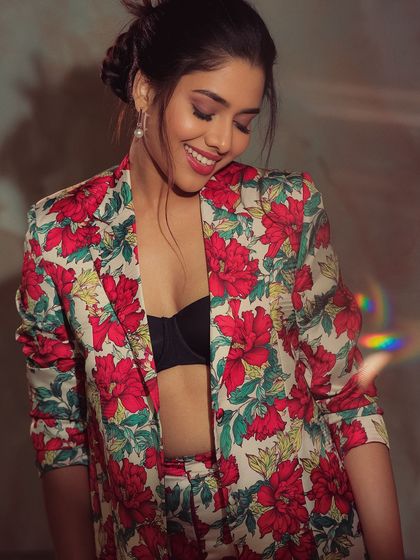 Another smiling shot of Karunya, showcasing her beautiful teeth and joyful expression. The makeup is fresh and enhances her natural beauty.