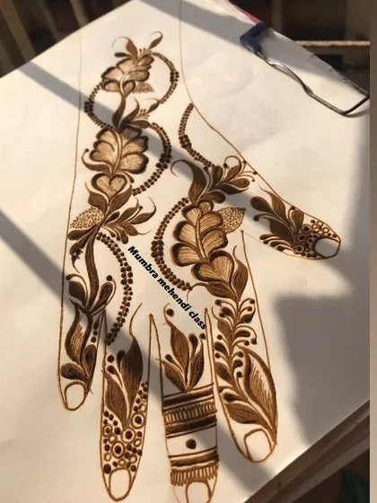A Qatar/Dubai style design on a practice sheet, combining leaves and beaded chains.
