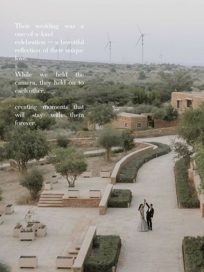 An aerial shot of the couple dancing in the expansive grounds of Suryagarh, with windmills in the distance. The overlay text adds a poetic layer to this beautiful destination wedding image.