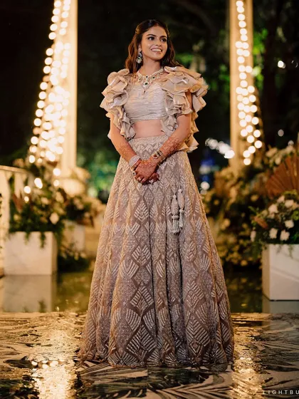 The sheer joy of getting my best friend ready for her engagement. This look is all about modern romance, with a soft smokey eye and a statement ruffled lehenga.