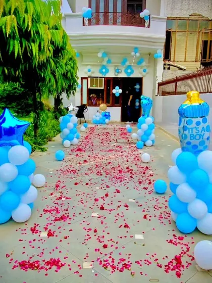 The first steps home should be magical. I create grand welcome entrances like this one, with a pathway of fresh rose petals, balloon pillars, and a big "It's a Boy!" foil balloon to announce the arrival of your prince.