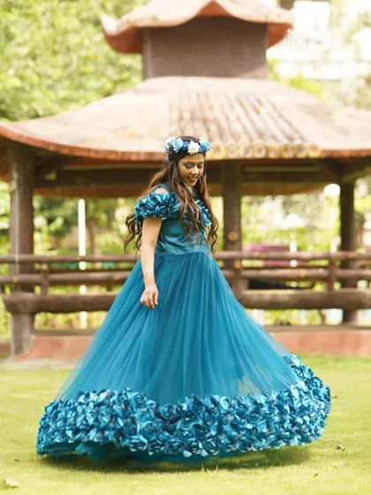 A closer look at the off shoulder design and 3D floral accents on this teal gown. Most of my rentals, including this one, come with complimentary accessories like this beautiful floral crown to complete your look without any extra hassle.