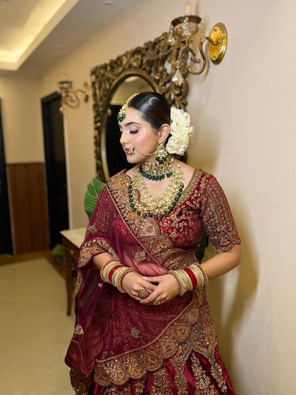 A side profile showcasing the clean, elegant hair and the soft contour of her makeup. This is a perfect example of subtle glam that enhances rather than masks.