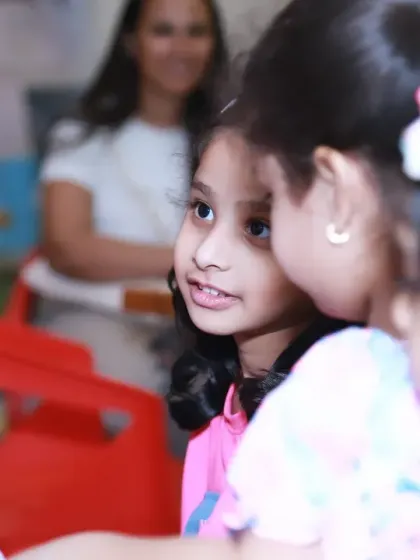 A sweet moment of conversation between little friends at a party. These are the quiet, candid interactions that are just as important to document as the big, energetic ones.