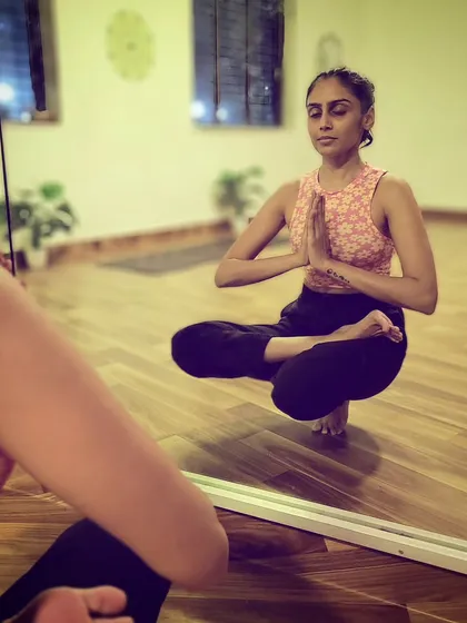 Challenging my balance with Padangusthasana in Ardha Padmasana, or toe stand in half lotus. I could only hold it for a few seconds, but every attempt is part of the practice.