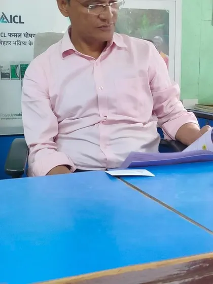 A local dealer in Barwani reviews our product catalog. We work closely with our dealer network to ensure they are well-equipped to provide the best information and support to farmers in their region.