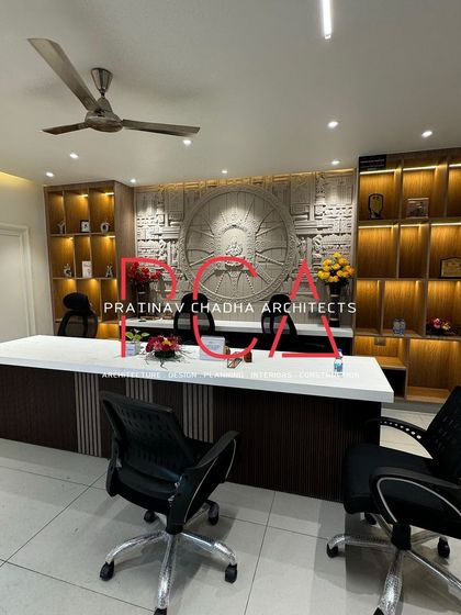 The completed Hari Mandir office on its opening day, with flowers and a clear view of the intricate mural and shelving.