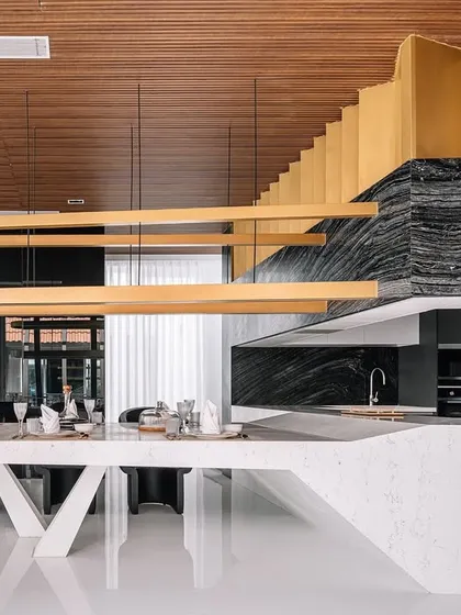 The open-plan living and dining area in Tellado Villas is a study in material contrast and minimalist elegance. I used a thoughtful selection of stones and a soft wooden backdrop to create a space that feels both luxurious and contextually grounded.