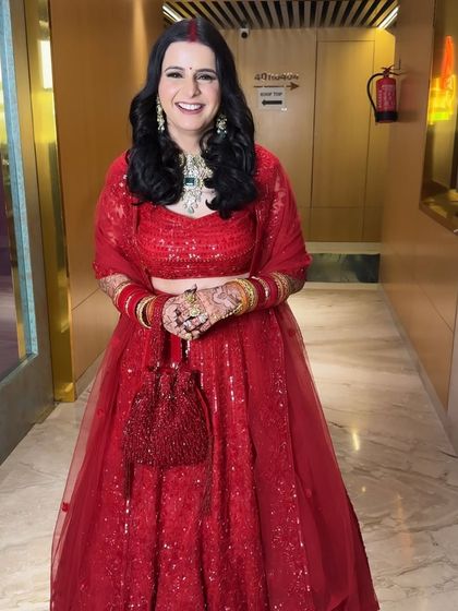 Monika's happy smile completes her stunning reception look. This is the kind of radiant, confident energy I love to create for my brides.