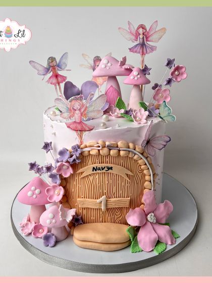 Step into an enchanted woodland with this fairy-themed cake for Navya. It features a fairy door, whimsical mushrooms, and delicate fairy toppers.