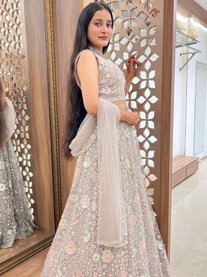A side view of the grey floral lehenga, showing its elegant fit in my store.