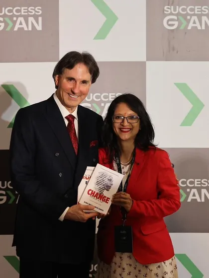 Presenting my books to my mentor, Dr. John Demartini. When we invest in our personal growth, we create a ripple effect that betters the world.