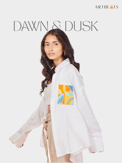 The Dawn & Dusk oversized hemp shirt. The art on the pocket is inspired by the colors of sunrise and sunset, making this a simple yet poetic piece for everyday wear.